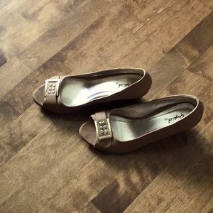 Tan and gold shoes